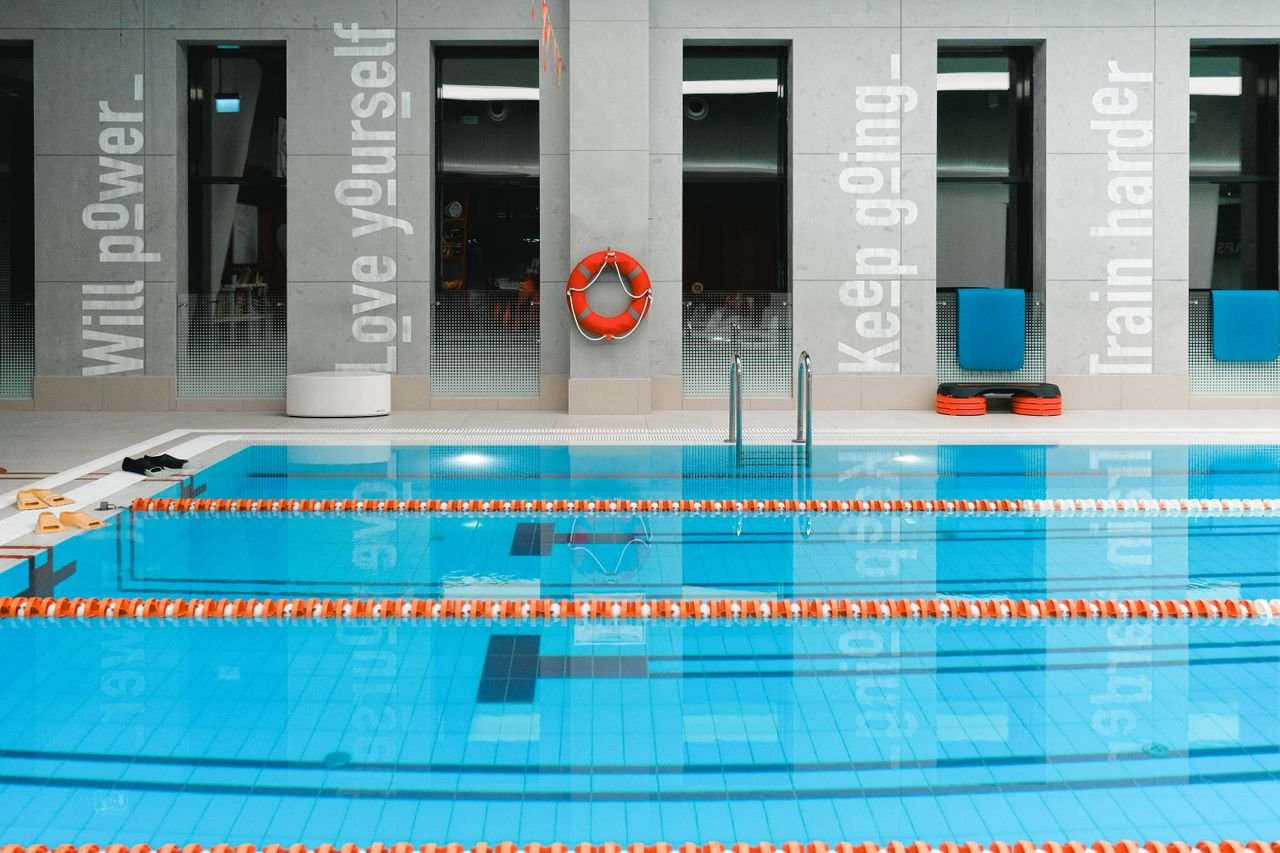 Comprehensive swimming pool maintenance including pump equipment servicing and deep wall brushing